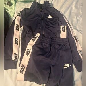 navy nike jump suit. boys 7